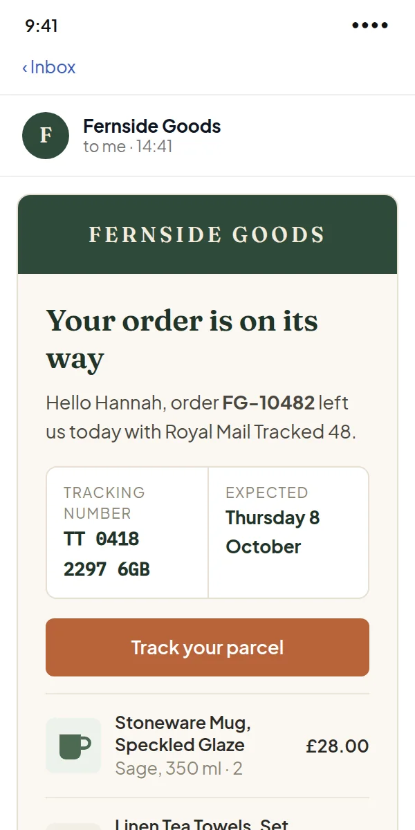 The shipped email on a phone, with the tracking number and the items in the parcel